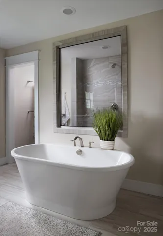 a white bath tub sitting in a bathroom