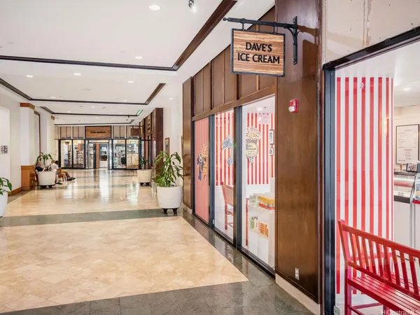 a view of a hallway with wooden walls