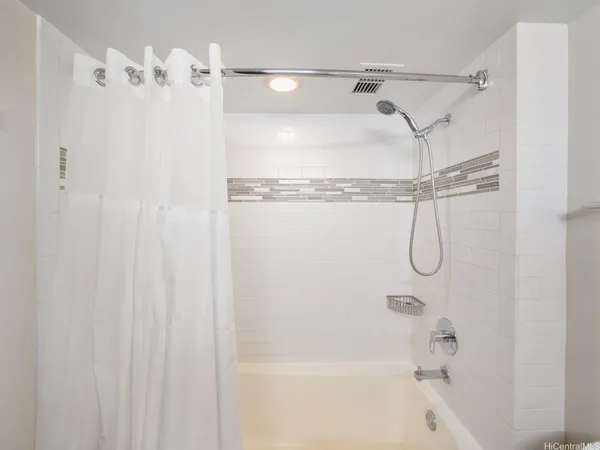 a bathroom with a shower and a shower