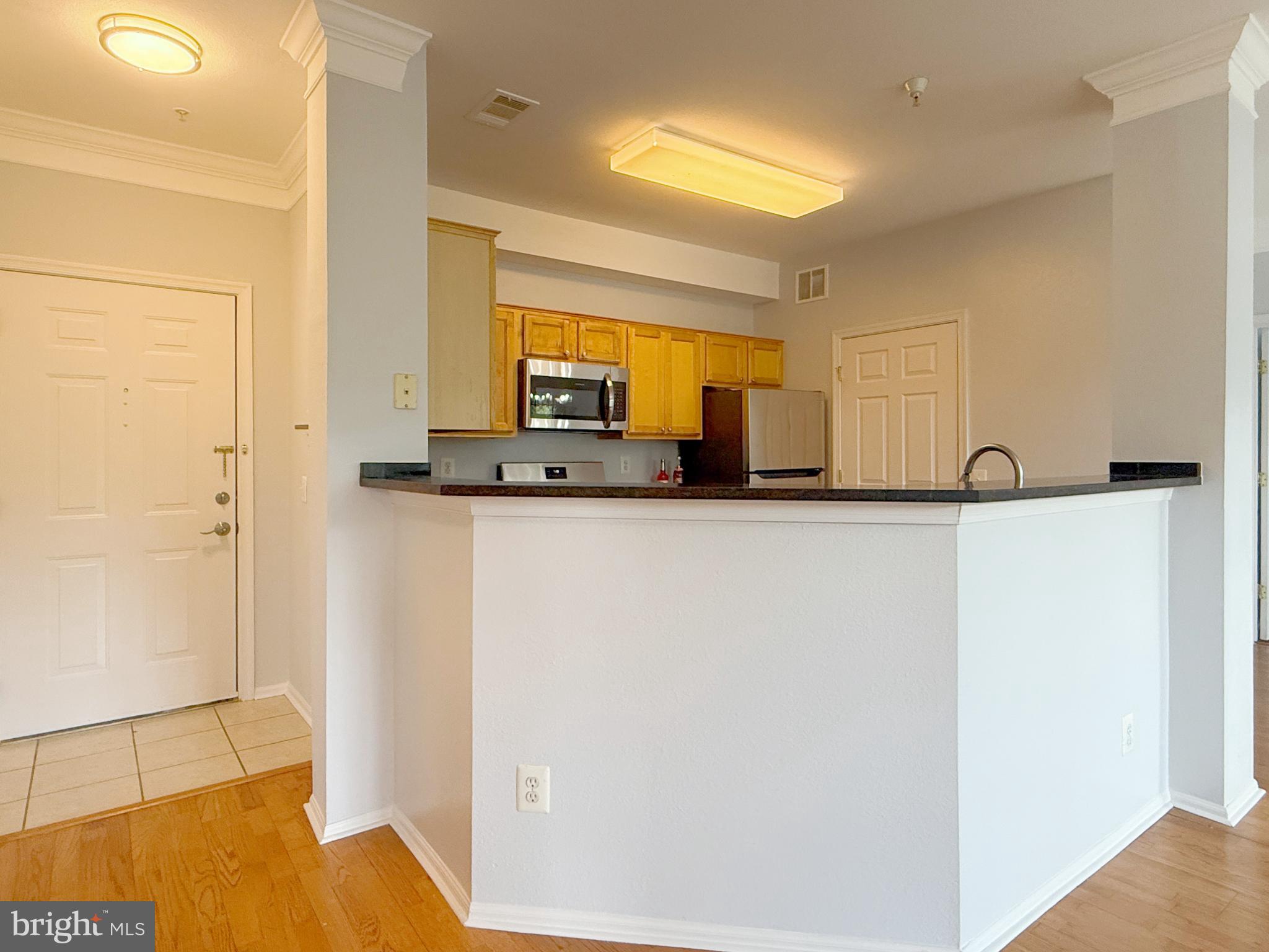 1530 Spring Gate Dr., Unit 9317 McLean, VA 22102 - Photo 12 of 55 Modern kitchen with open layout charm.