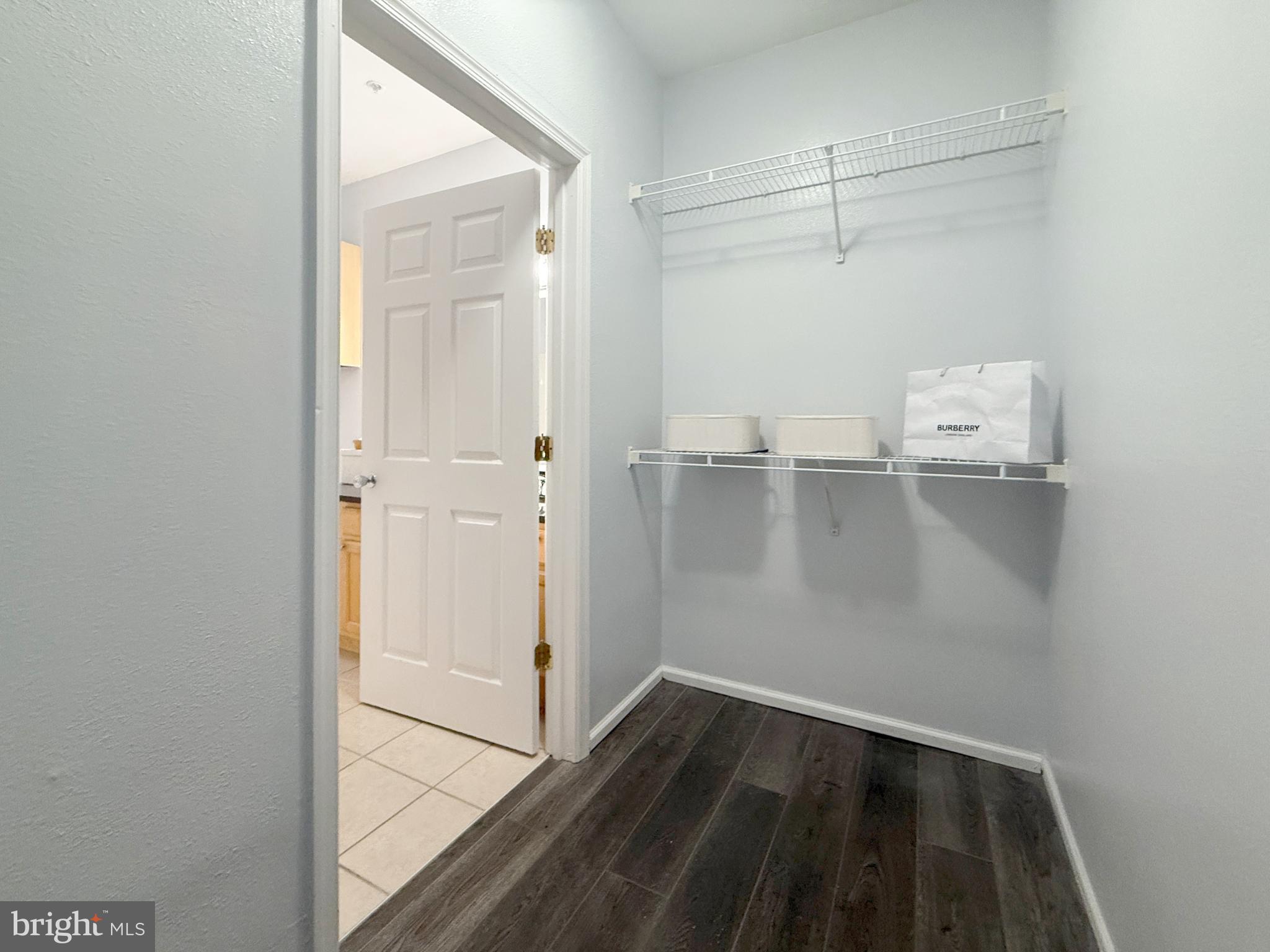 1530 Spring Gate Dr., Unit 9317 McLean, VA 22102 - Photo 27 of 55 Spacious entryway with modern shelving.