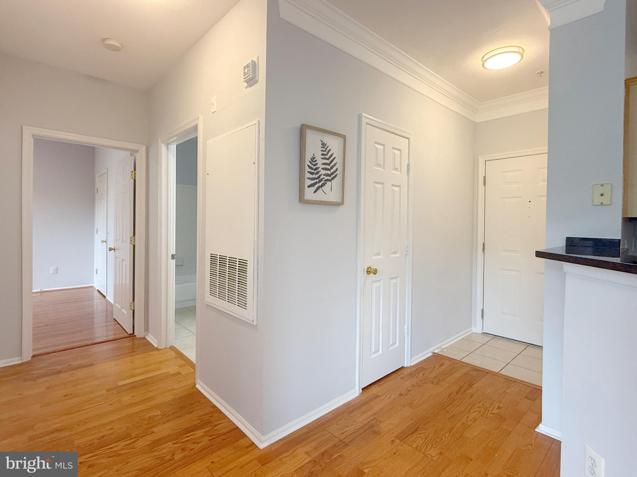1530 Spring Gate Dr., Unit 9317 McLean, VA 22102 - Photo 29 of 55 Inviting entryway with warm wooden floors.