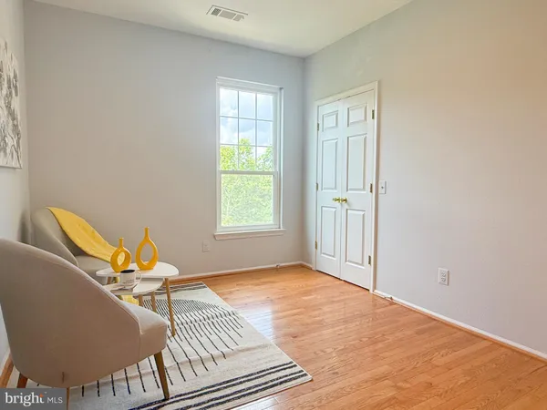 a view of a room with wooden floor