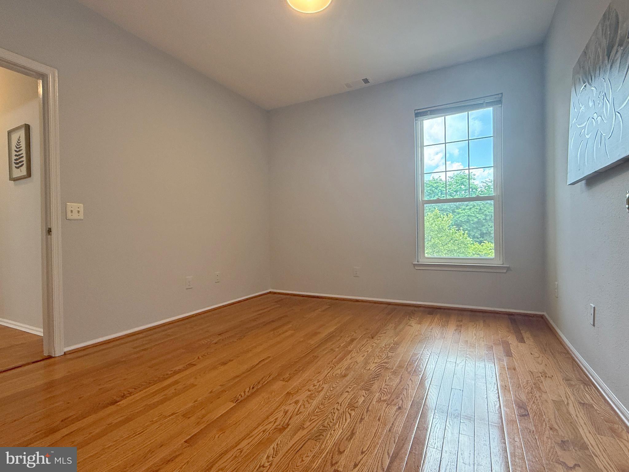 1530 Spring Gate Dr., Unit 9317 McLean, VA 22102 - Photo 36 of 55 Bright and airy room with hardwood floors.