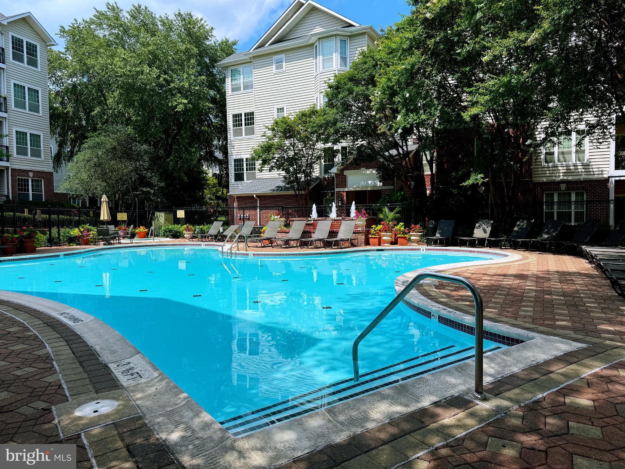 1530 Spring Gate Dr., Unit 9317 McLean, VA 22102 - Photo 53 of 55 Serene poolside retreat in lush surroundings.