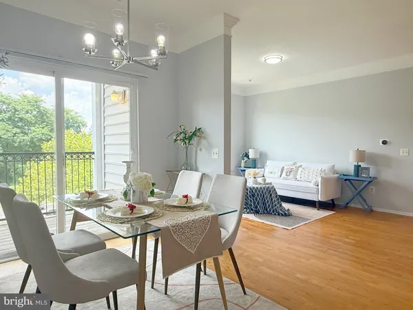 a workspace with furniture and a large window