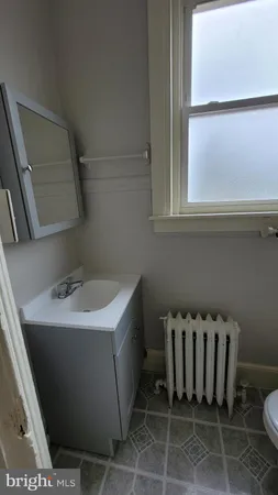 a bathroom with a toilet and a sink