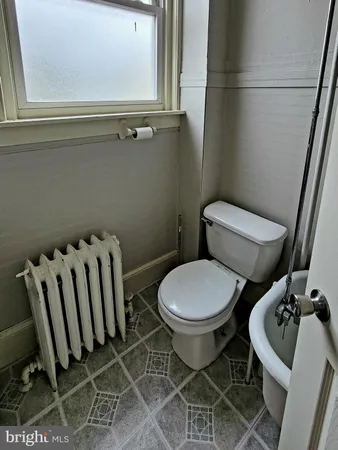 a bathroom with a sink and toilet