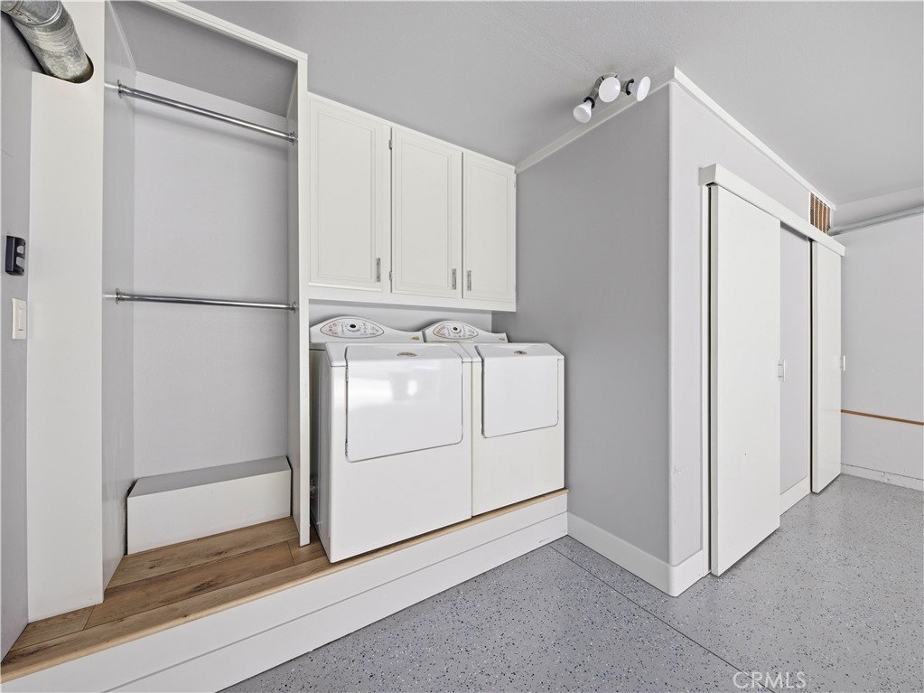 25710 Holiday, Unit C Stevenson Ranch, CA 91381 - Photo 22 of 29 Custom garage laundry area and storage.