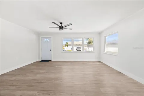 a view of an empty room with a window