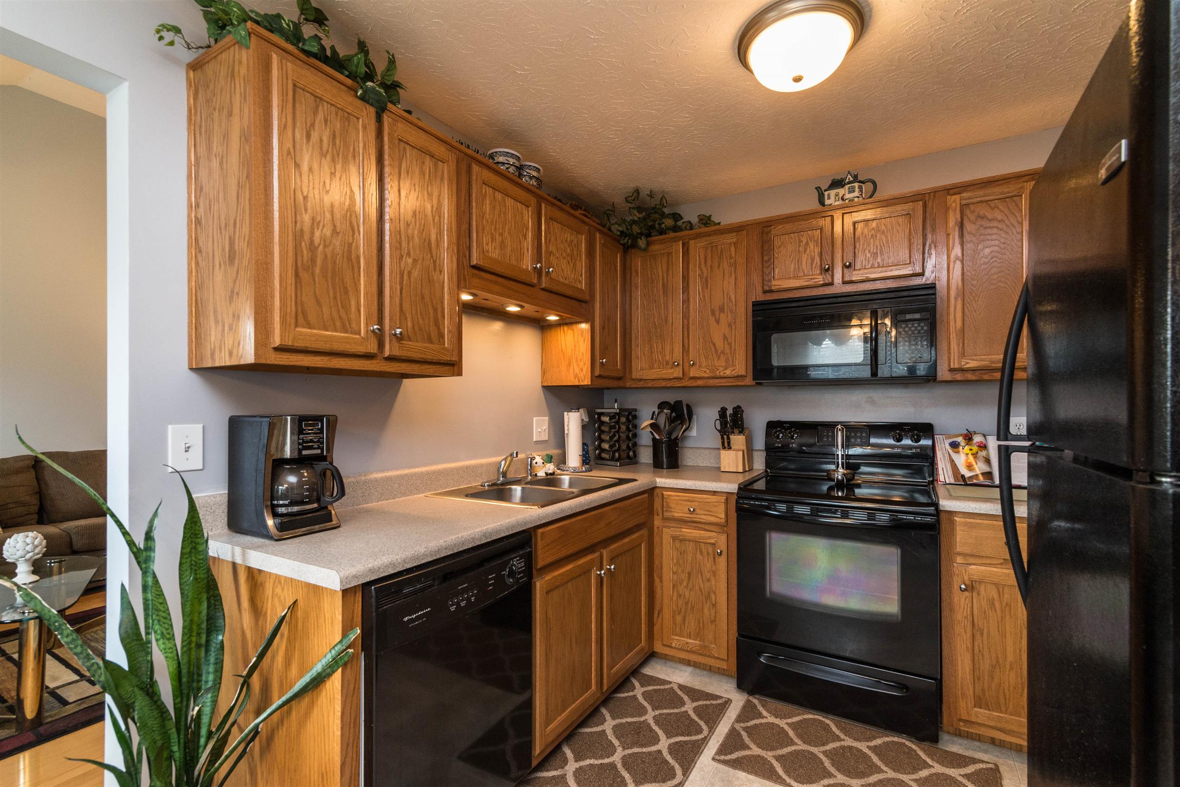 1355 Cedar Grove Road Lebanon, TN 37087 - Photo 2 of 12 a kitchen with stainless steel appliances granite countertop a stove a sink dishwasher and a microwave oven on the blue kitchen countertops