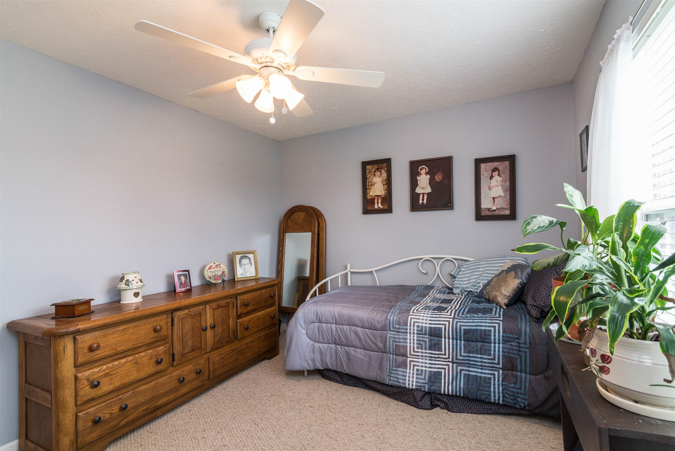 1355 Cedar Grove Road Lebanon, TN 37087 - Photo 11 of 12 a bedroom with bed and paintings on the wall