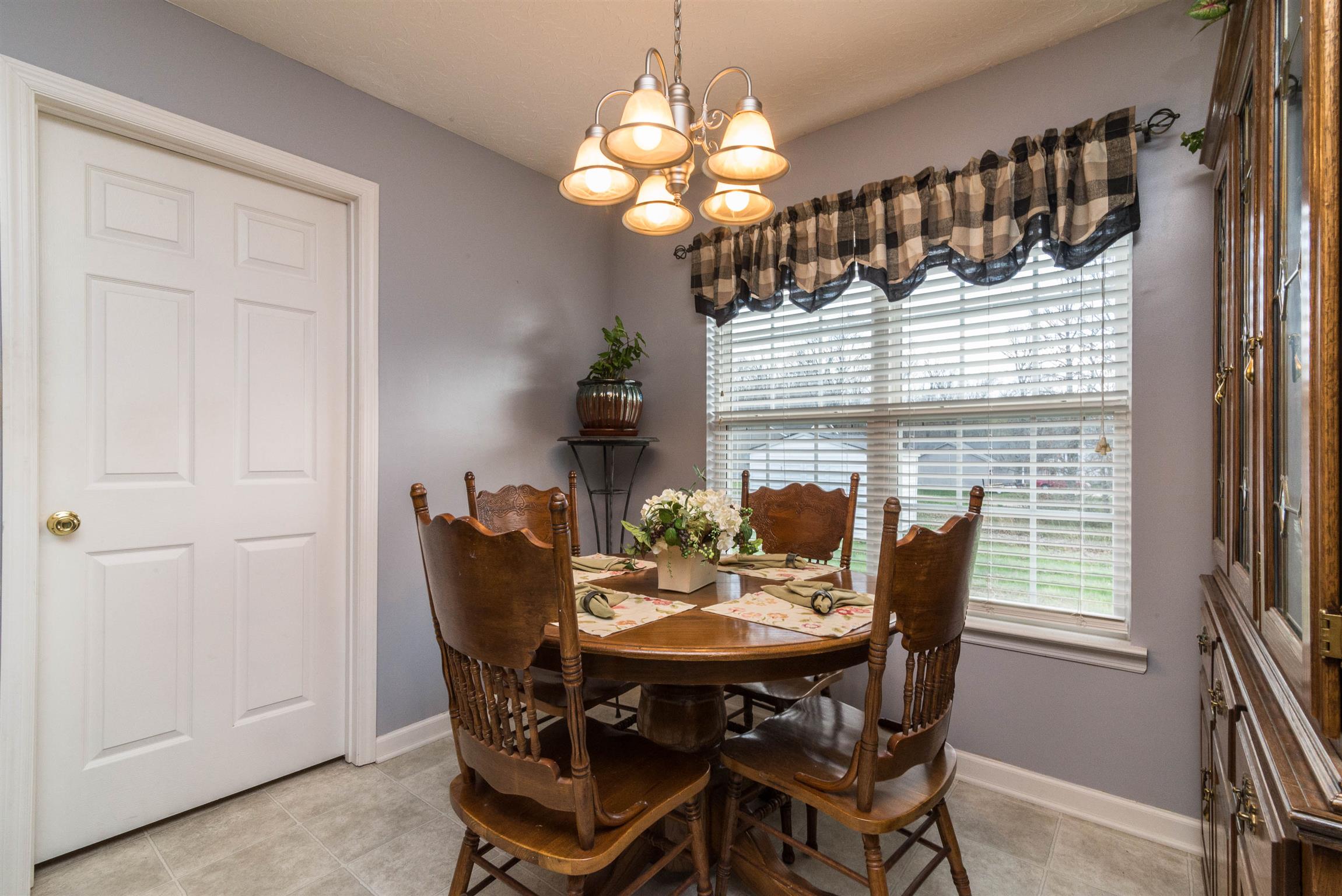 1355 Cedar Grove Road Lebanon, TN 37087 - Photo 6 of 12 a view of a dining room with furniture and chandelier