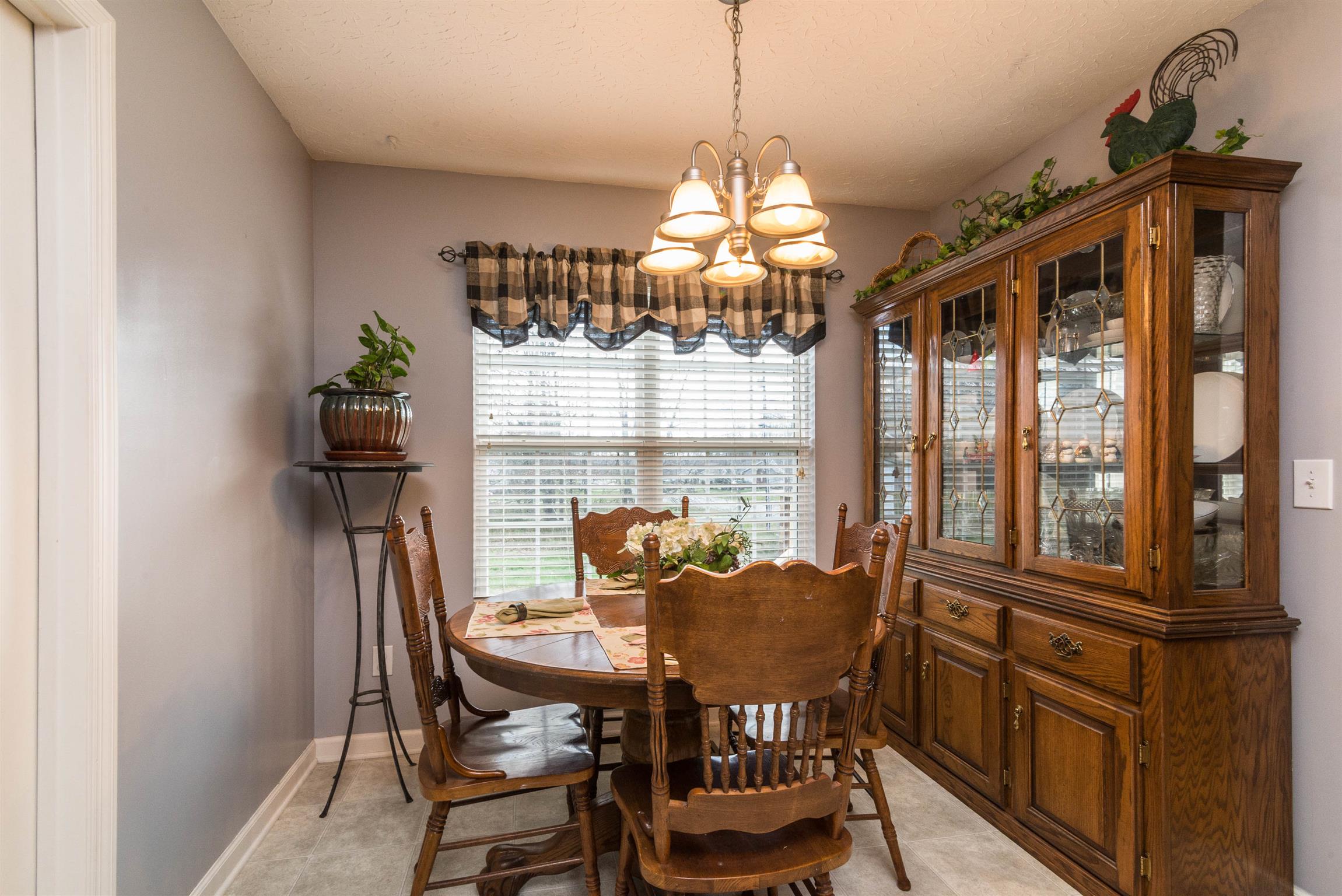 1355 Cedar Grove Road Lebanon, TN 37087 - Photo 7 of 12 a view of a dining room with furniture a chandelier and large windows