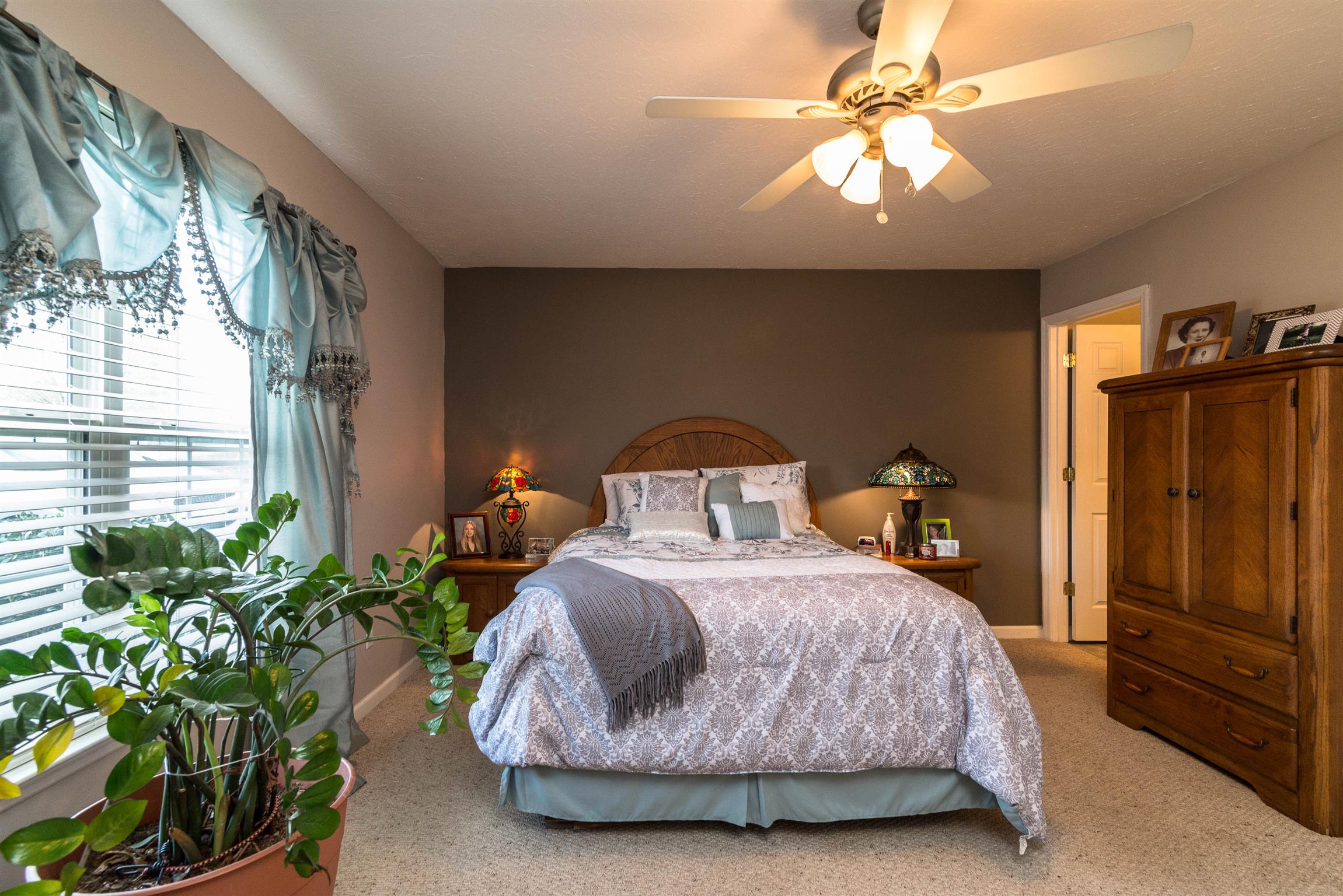 1355 Cedar Grove Road Lebanon, TN 37087 - Photo 8 of 12 a bedroom with a bed and a chandelier