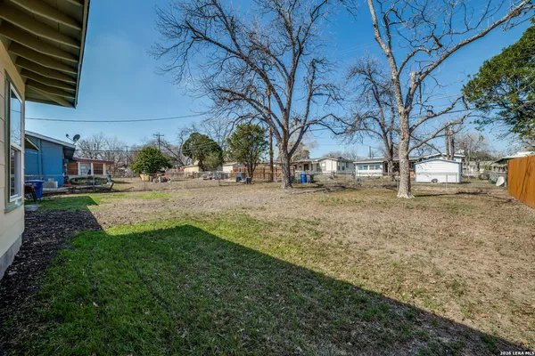 a view of road with large trees