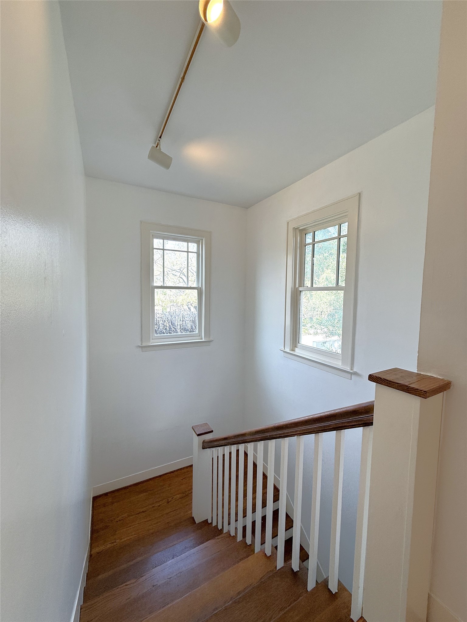 2311 Wroxton Road Houston, TX 77005 - Photo 3 of 24 Windows bring natural light into the entry stairway.