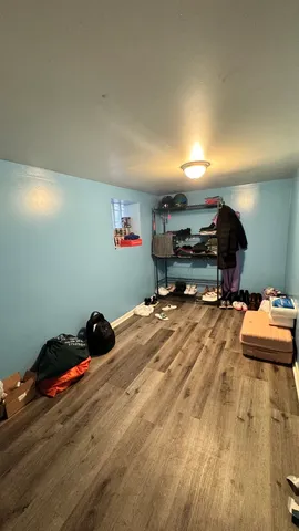 a room with furniture and a wooden floor