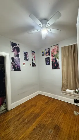 a view of a room with wooden floor