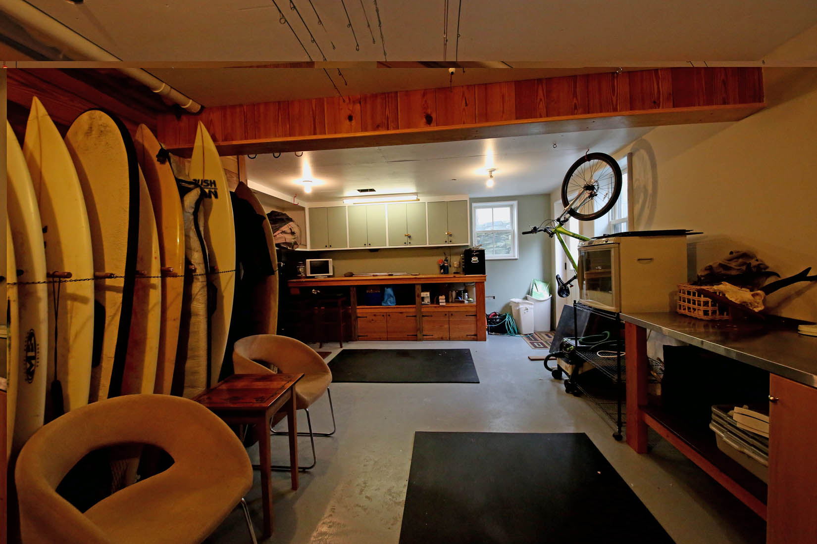 65 B Fairgrounds Road, Unit 2 Nantucket, MA 02554 - Photo 24 of 24 Second half of basement used as workshop/surfboard storage, and laundry. (not shown in photo)