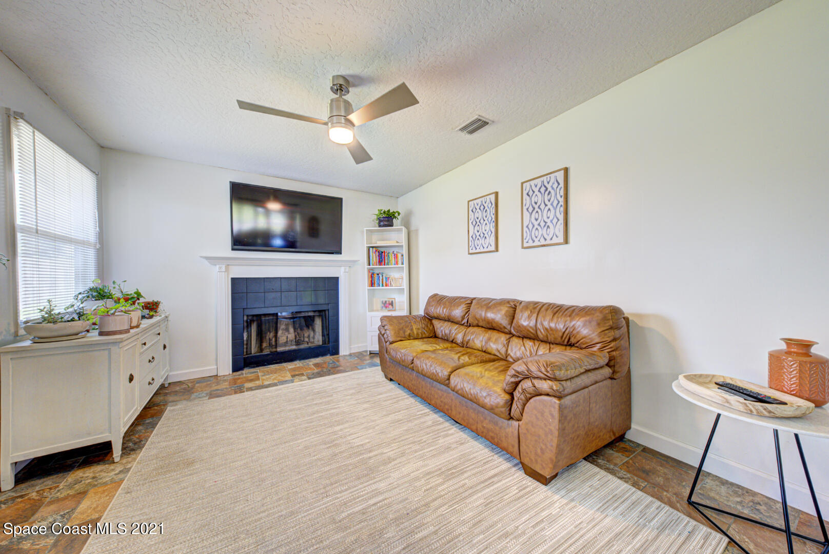 860 Croton Road Rockledge, FL 32955 - Photo 13 of 24 family room with fireplace