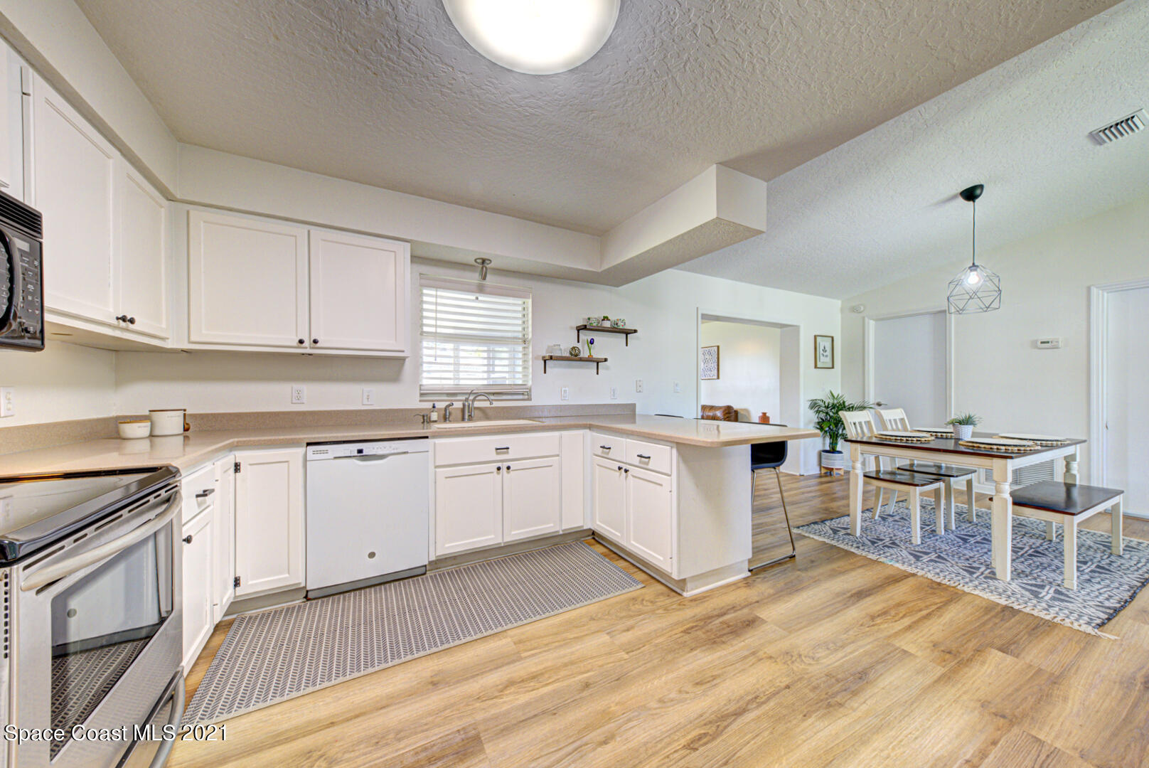 860 Croton Road Rockledge, FL 32955 - Photo 9 of 24 kitchen open to dining room