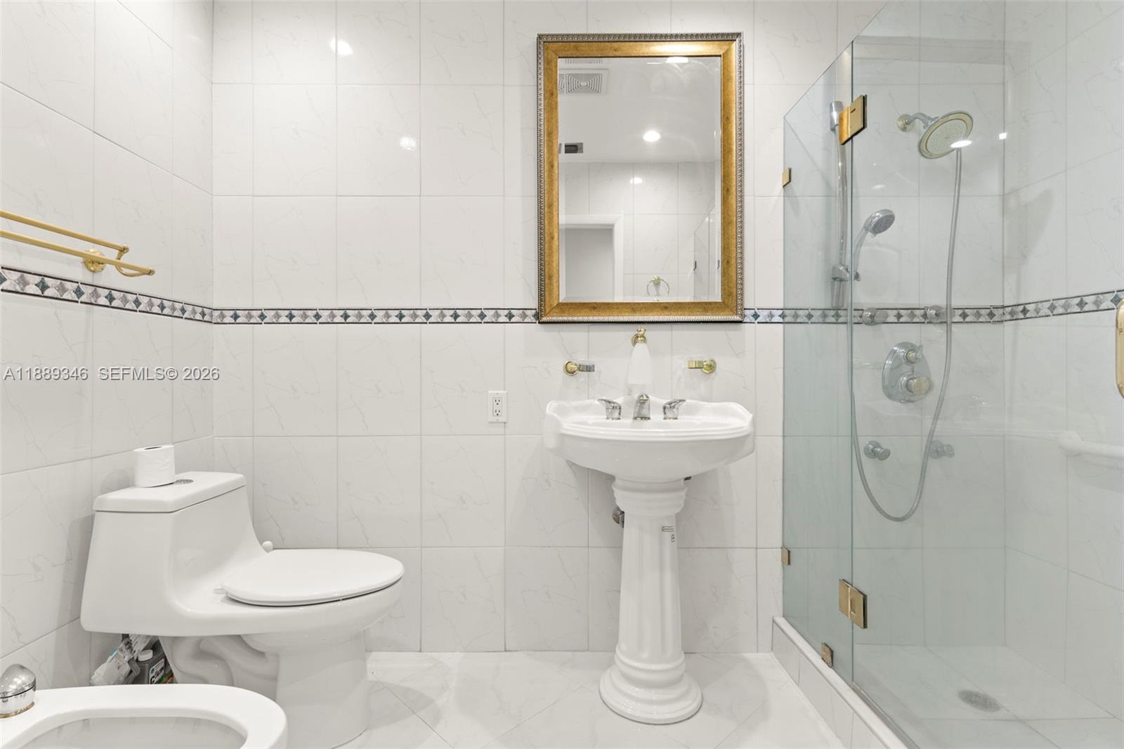 300 93rd Street Surfside, FL 33154 - Photo 18 of 34 a bathroom with a sink toilet and shower