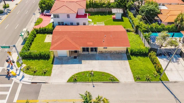 a kitchen with stainless steel appliances a refrigerator and a fireplace