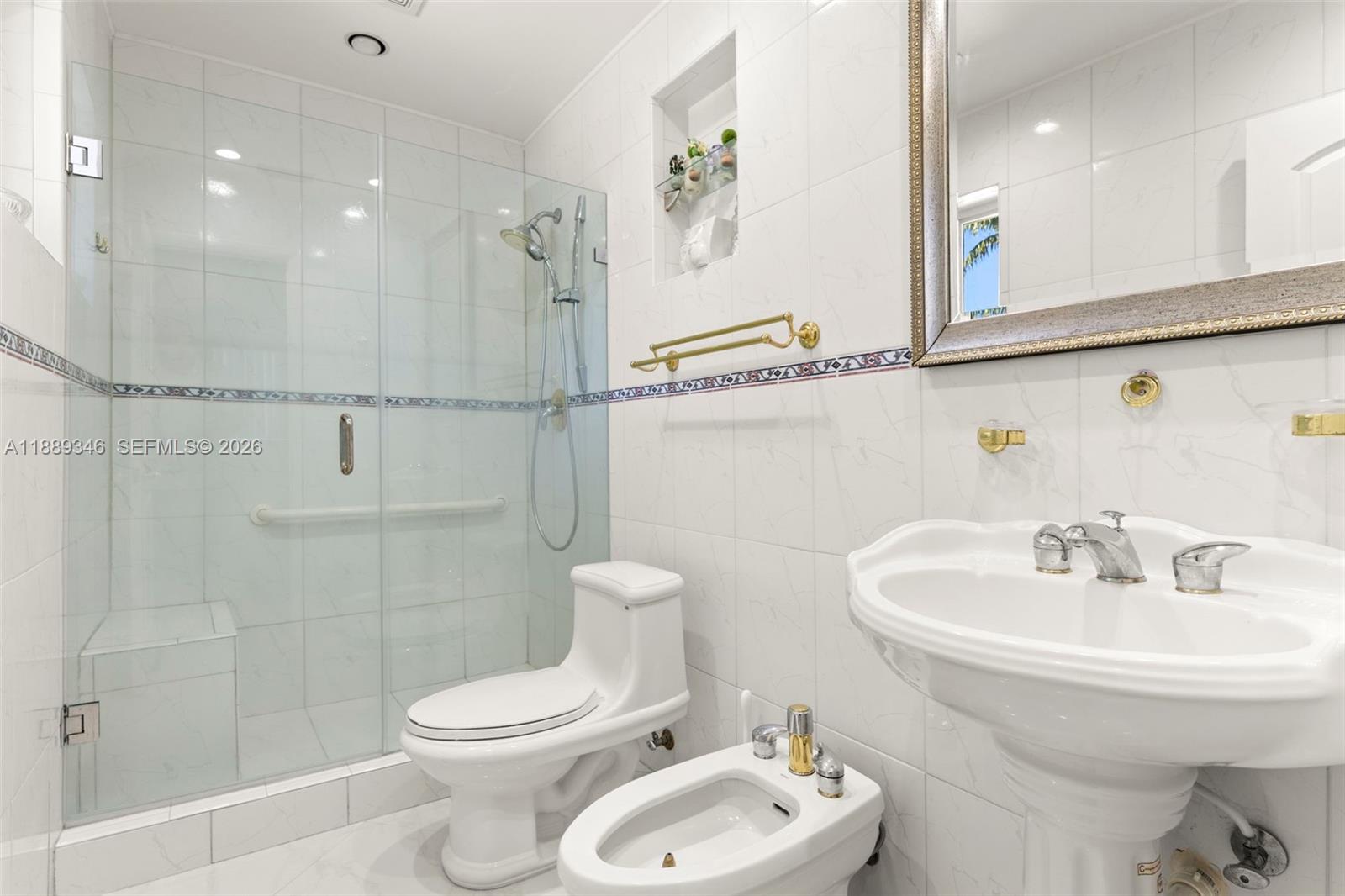 300 93rd Street Surfside, FL 33154 - Photo 27 of 34 a bathroom with a sink toilet and shower