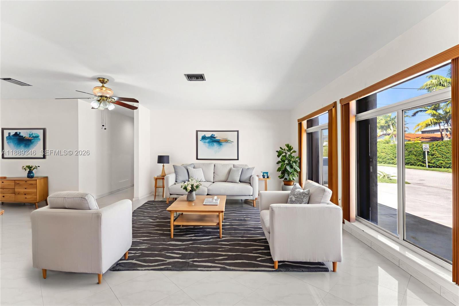 300 93rd Street Surfside, FL 33154 - Photo 31 of 34 a living room with furniture and a large window