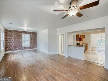 651 Moreland Avenue Southeast Atlanta, GA 30316 - Photo 3 of 11 a view of a kitchen with a sink hardwood floor and a kitchen counter top space