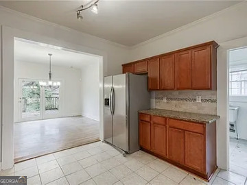 651 Moreland Avenue Southeast Atlanta, GA 30316 - Photo 5 of 11 a kitchen with stainless steel appliances granite countertop a refrigerator and a sink