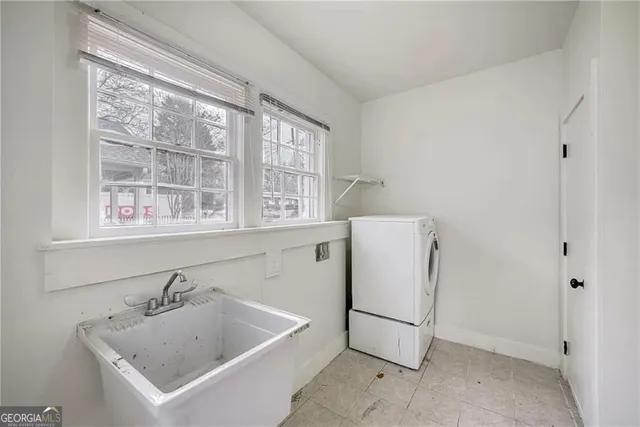 a utility room with a window dryer and washer