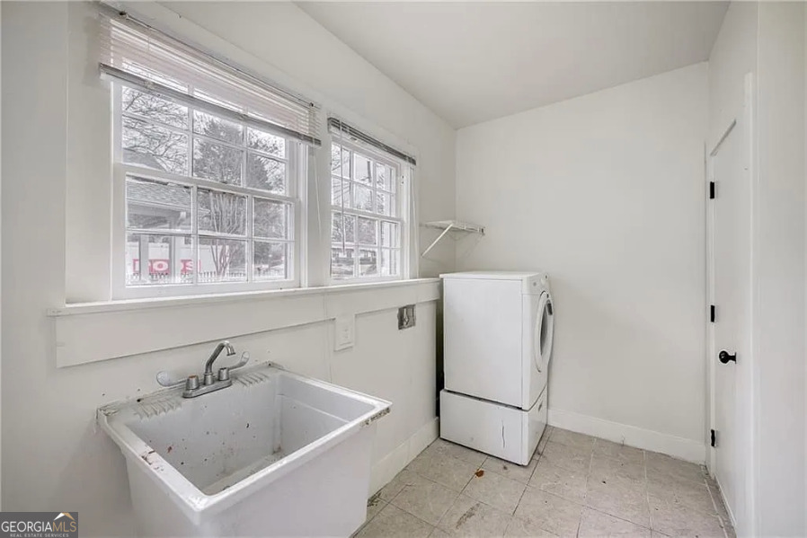 651 Moreland Avenue Southeast Atlanta, GA 30316 - Photo 6 of 11 a utility room with a window dryer and washer