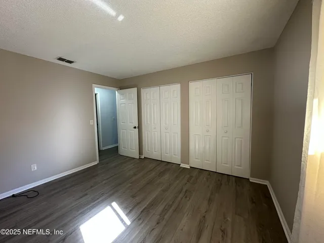 a white toilet sitting next to a bath tub