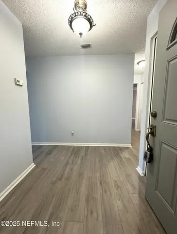 a kitchen with stainless steel appliances granite countertop a refrigerator a sink dishwasher a stove and a microwave oven on granite countertops