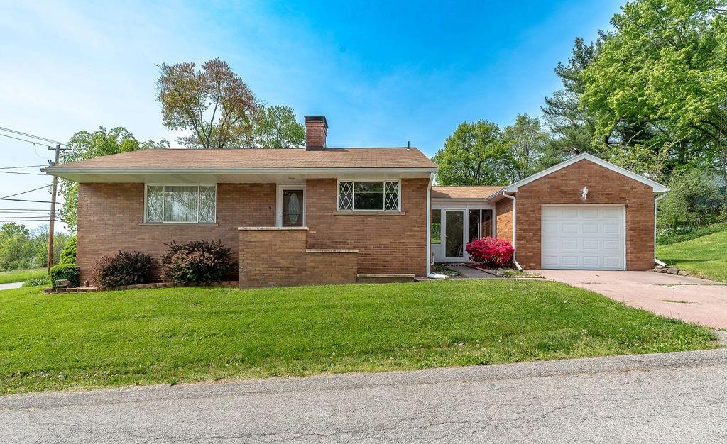 767 Virginia Avenue Rochester, PA 15074 - Photo 1 of 16 a front view of a house with a yard and garage