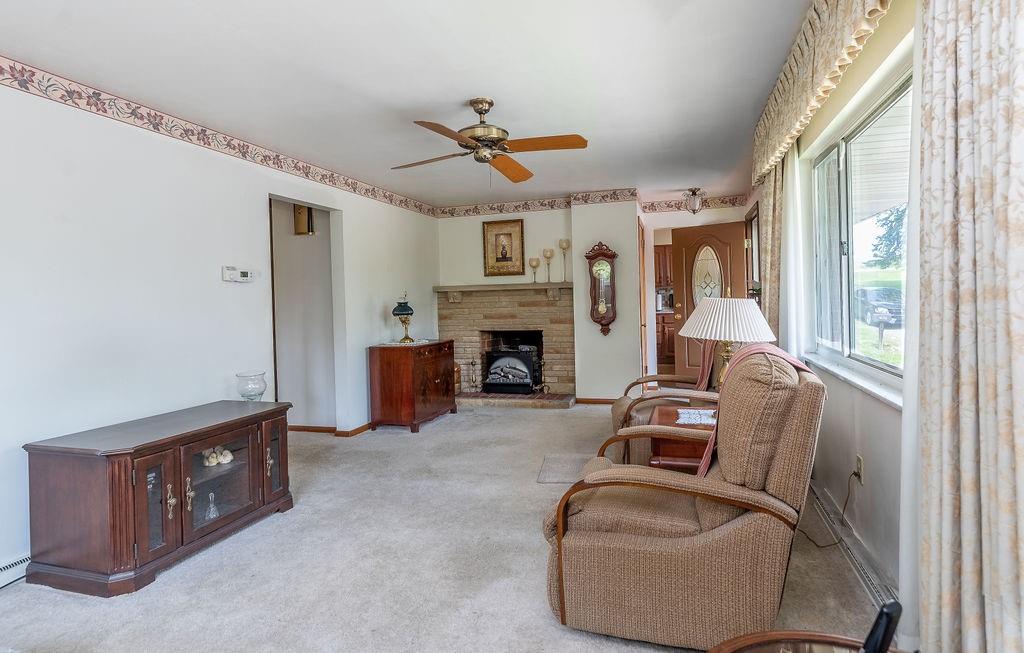 767 Virginia Avenue Rochester, PA 15074 - Photo 5 of 16 a living room with furniture and a fireplace