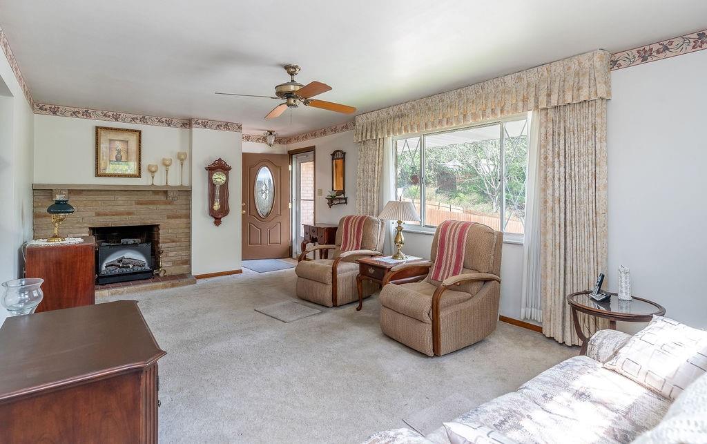 767 Virginia Avenue Rochester, PA 15074 - Photo 6 of 16 a living room with furniture and a fireplace