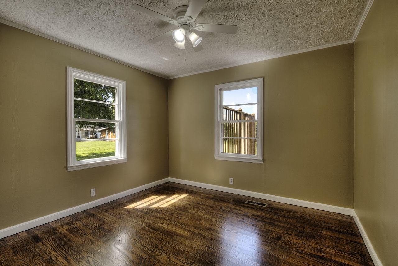 102 Stephens Road Greenback, TN 37742 - Photo 15 of 31 a view of an empty room with wooden floor and a window