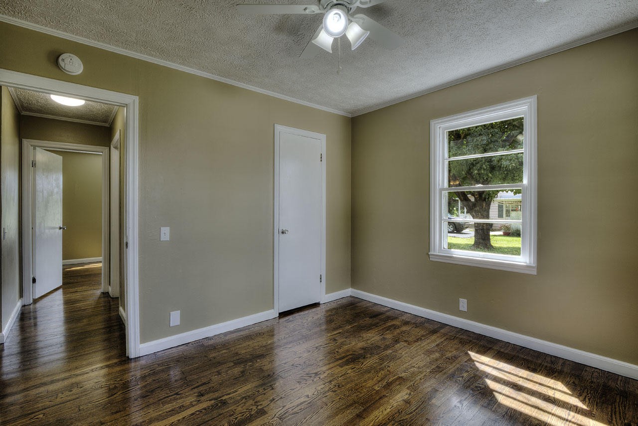 102 Stephens Road Greenback, TN 37742 - Photo 16 of 31 a view of an empty room with wooden floor and a window