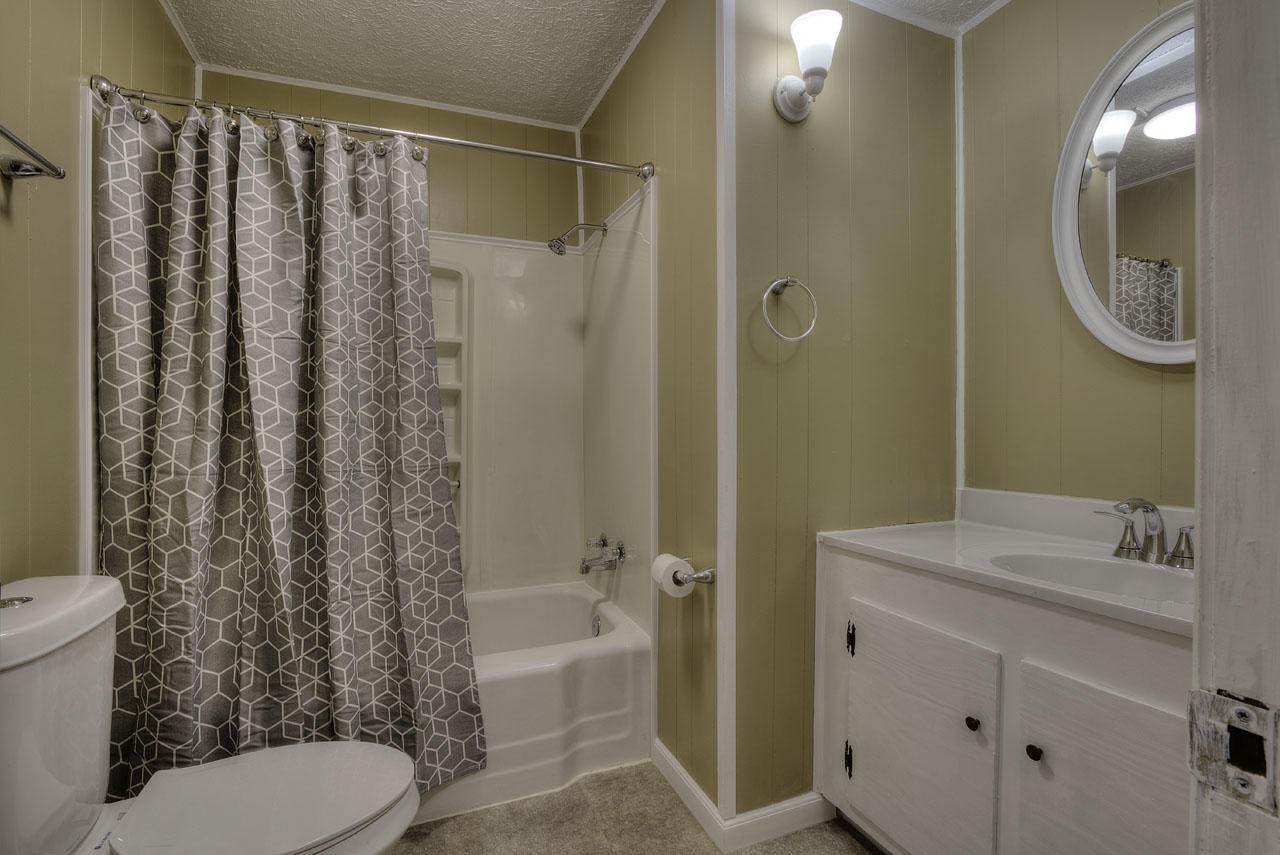 102 Stephens Road Greenback, TN 37742 - Photo 18 of 31 a bathroom with a sink toilet and shower