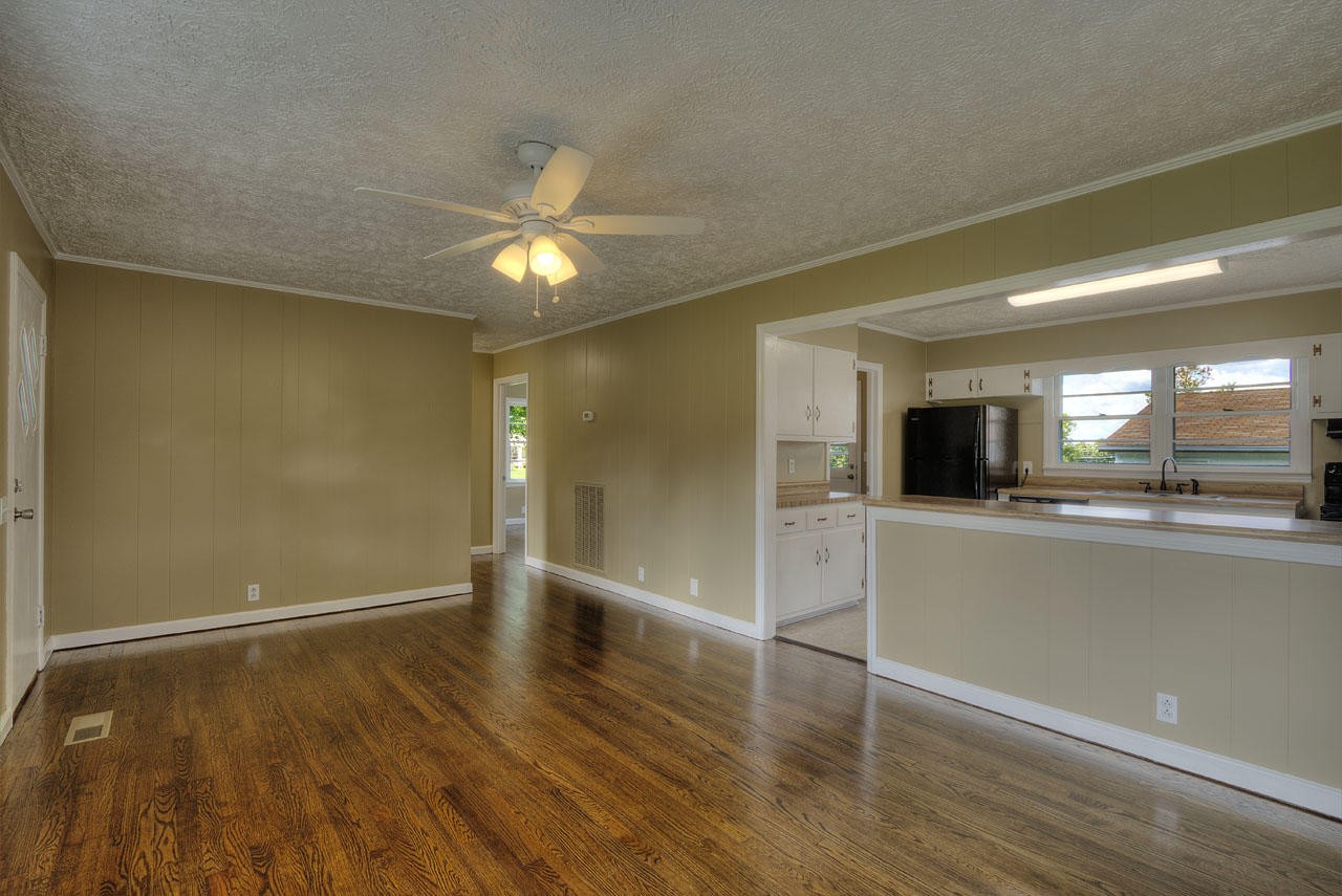 102 Stephens Road Greenback, TN 37742 - Photo 6 of 31 wooden floor in an empty room with a window