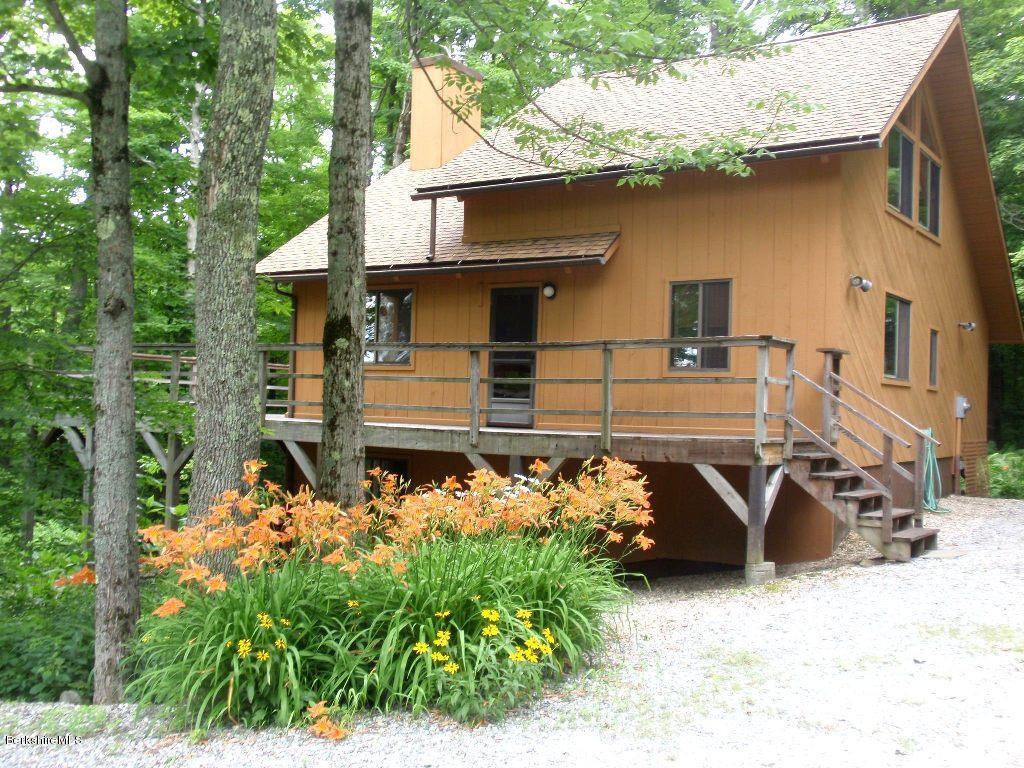 248 Stebbins Road Otis, MA 01253 - Photo 1 of 16 front view of a house with a street