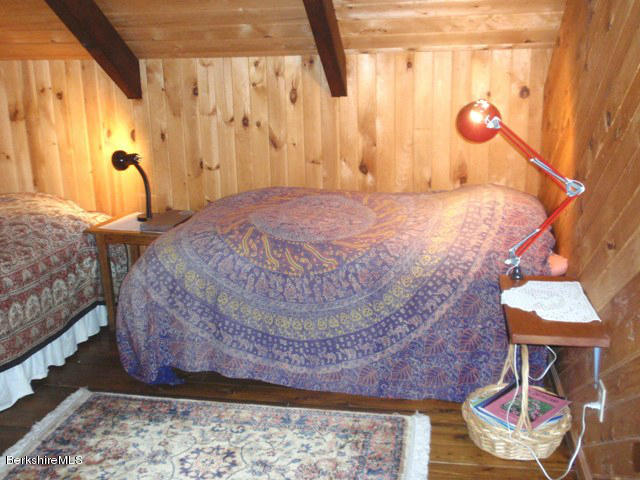 248 Stebbins Road Otis, MA 01253 - Photo 13 of 16 a bedroom with a bed and a window
