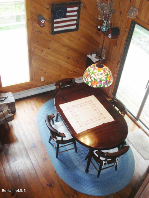 248 Stebbins Road Otis, MA 01253 - Photo 8 of 16 a room with furniture and wooden floor