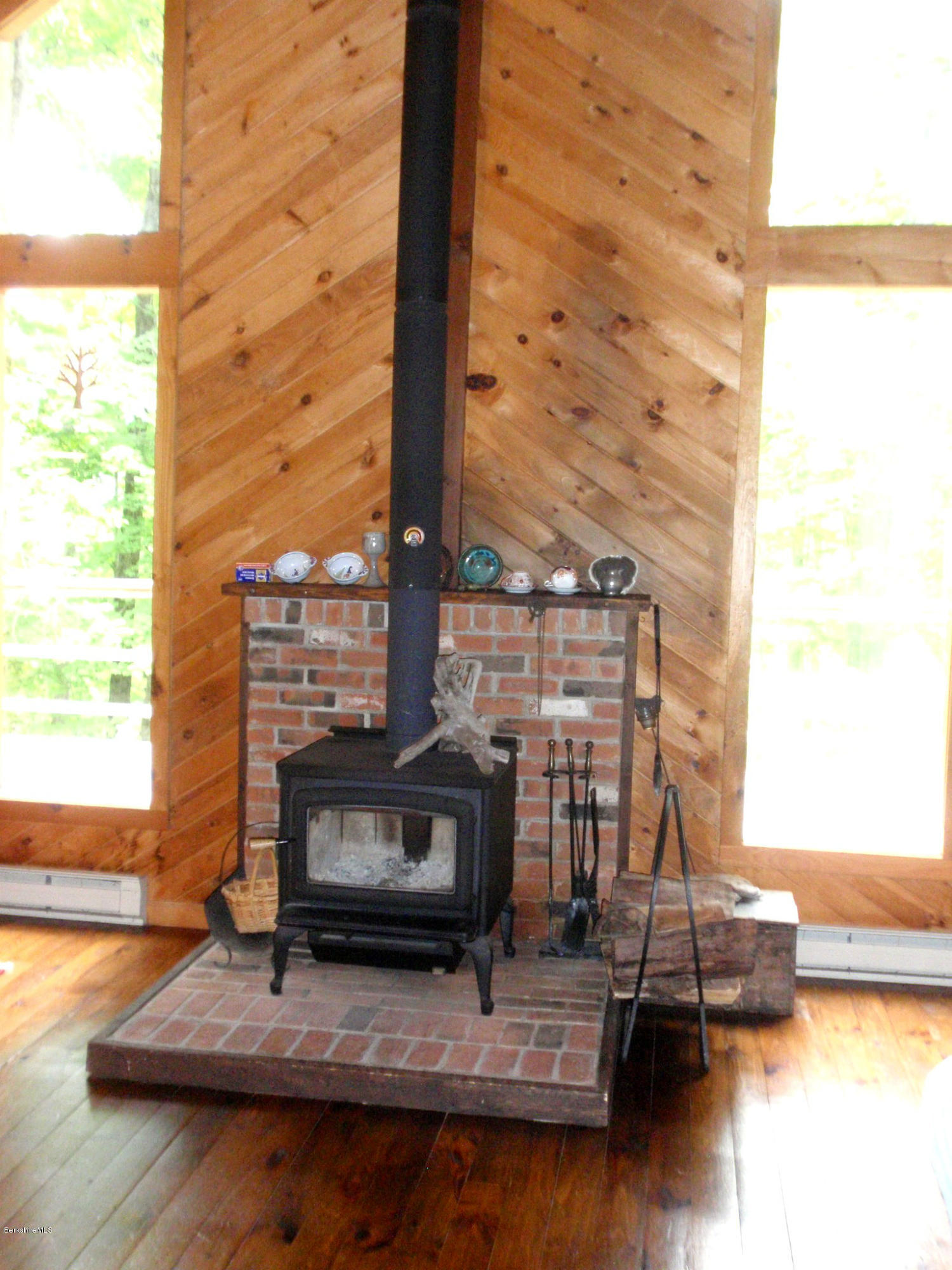248 Stebbins Road Otis, MA 01253 - Photo 9 of 16 a living room with furniture and a fireplace