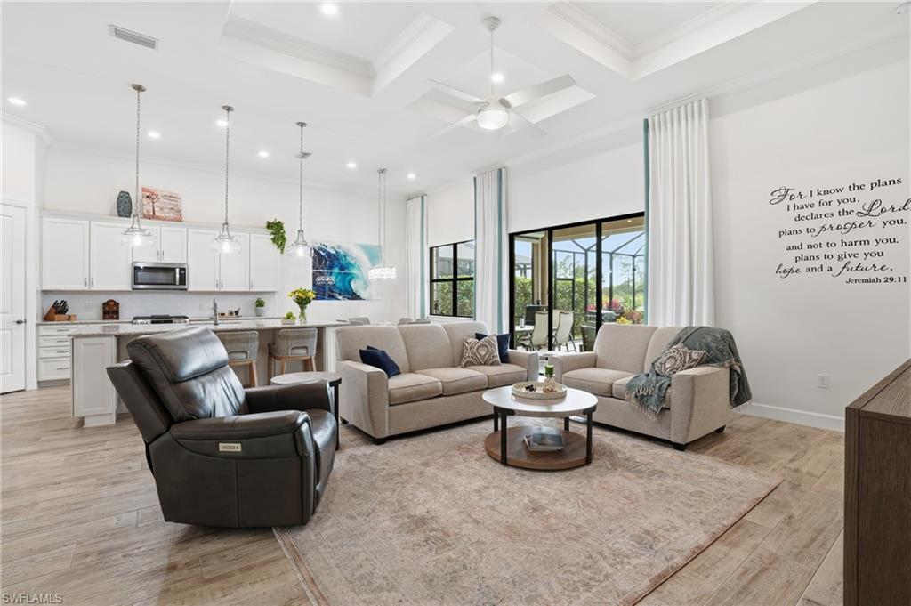 17210 Ashcomb Way Estero, FL 33928 - Photo 17 of 47 a living room with furniture and a large window