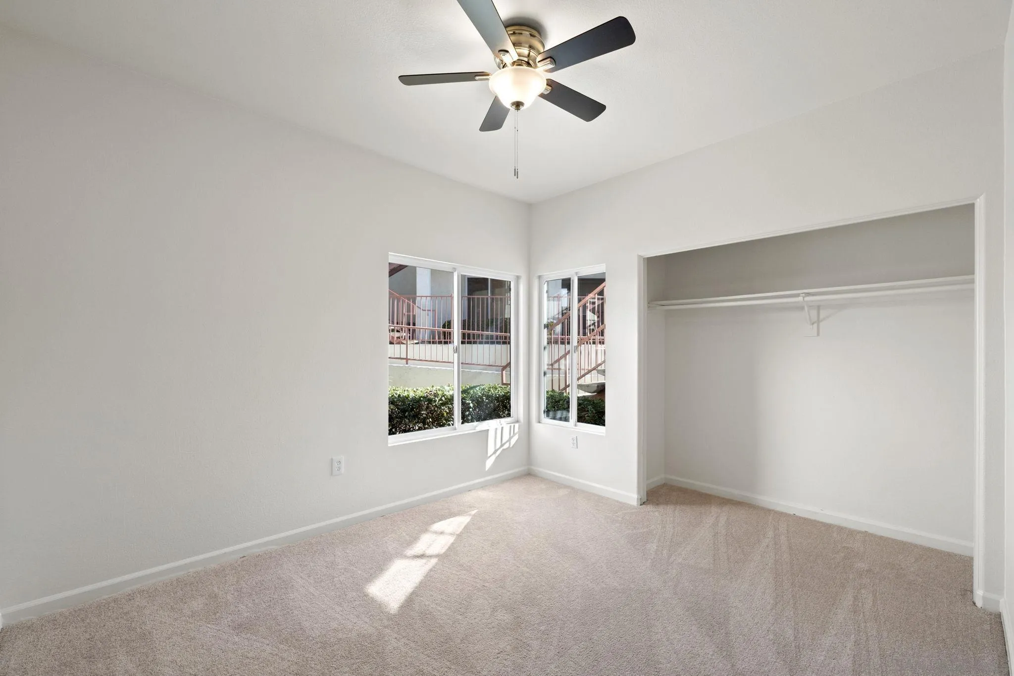 540 Ribbon Beach Way, Unit 292 Oceanside, CA 92058 - Photo 17 of 32 a view of a big room with windows and chandelier fan