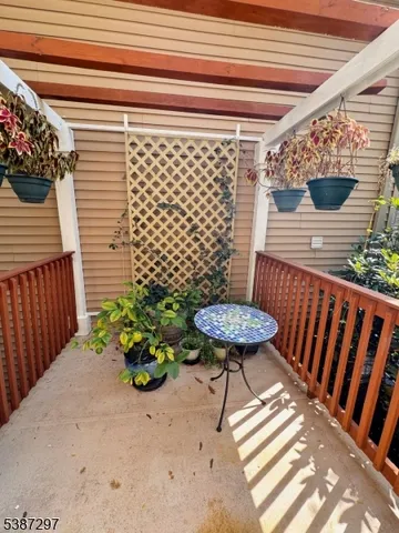a view of a chairs and table in the patio